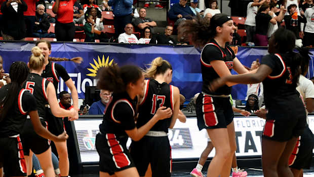 Fort Myers Evangelical Christian Academy players celebrate after winning the Class 2A girls basketball state championship on Thursday at the RP Funding Center in Lakeland.